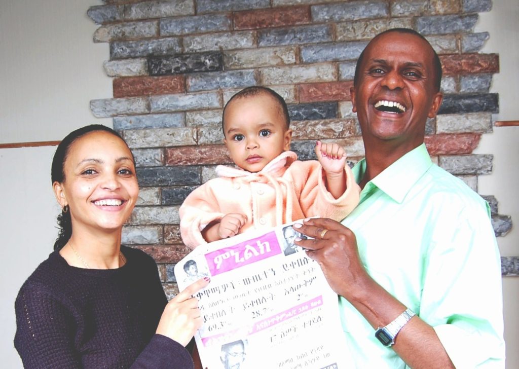 Serkalem Fasil, baby son Nafkot and husband Eskinder Nega