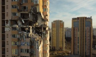 This general view shows damage to the upper floors of a building in Kyiv on February 26, 2022, after it was reportedly struck by a Russian rocket.. - Russia on February 26, 2022. Photo by Daniel LEAL / AFP) (Photo by DANIEL LEAL/AFP via Getty Images)