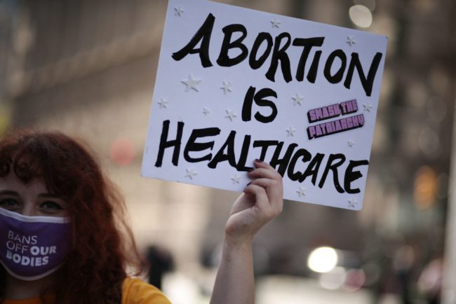 Protesters take part in the Women's March and Rally for Abortion Justice in New York, on October 2, 2021. - The abortion rights battle took to the streets across the US, with hundreds of demonstrations planned as part of a new "Women's March" aimed at countering an unprecedented conservative offensive to restrict the termination of pregnancies.