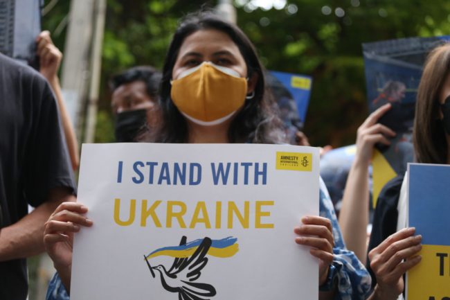 Amnesty International Thailand members and supporters take part in a Global Day of Action to demand that Russia end its invasion of Ukraine, 24 March, 2022.